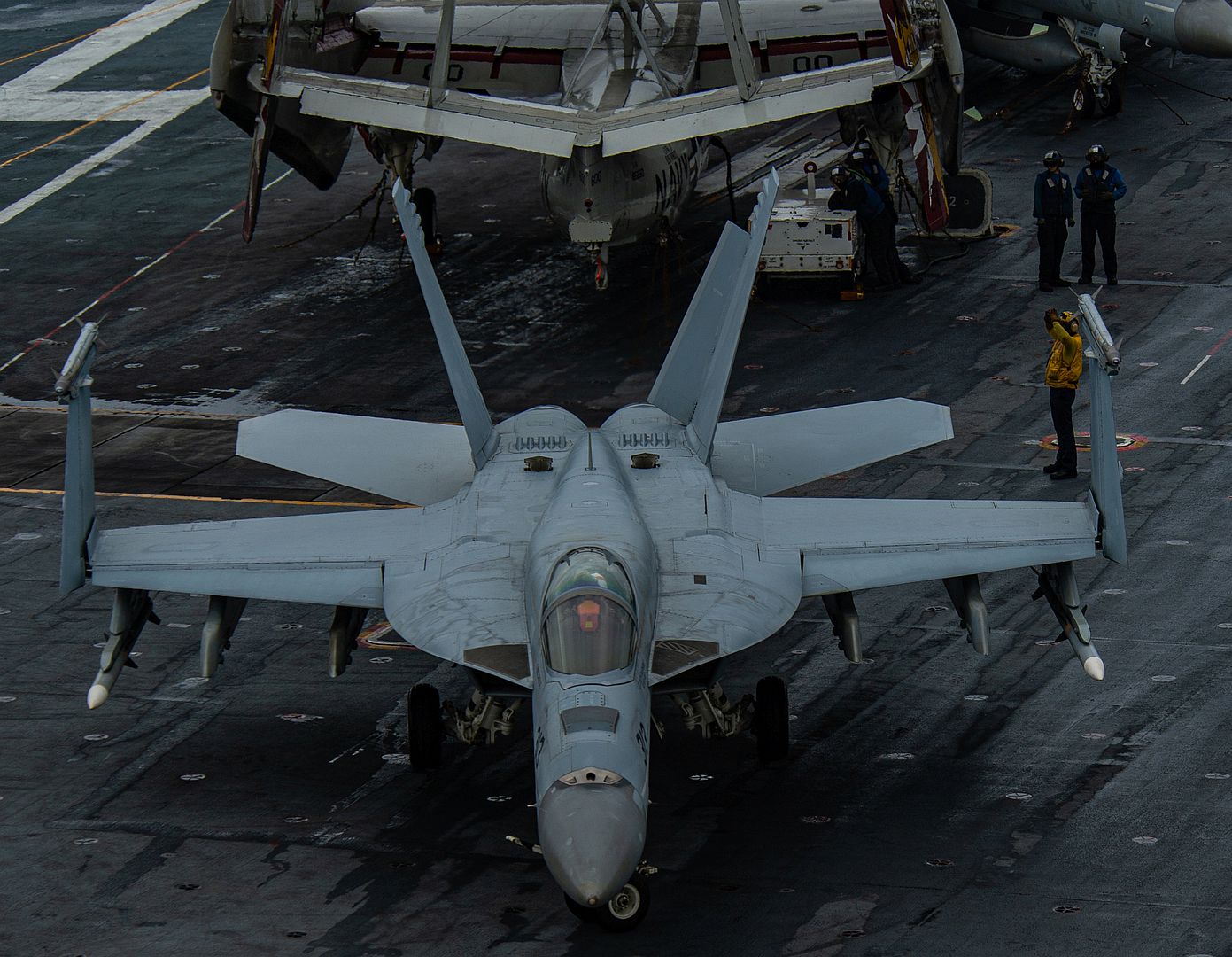 18E Super Hornet From The Kestrels Of Strike Fighter Squadron 137 Taxis Across The Flight Deck Of The Aircraft Carrier USS Nimitz