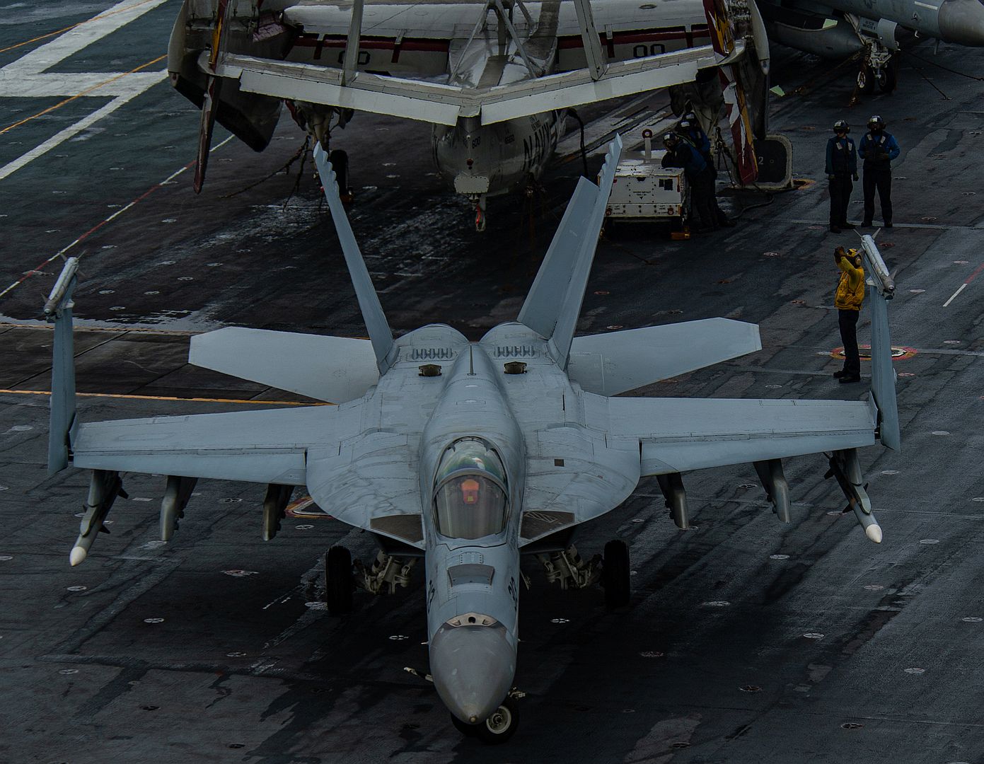 18E Super Hornet From The Kestrels Of Strike Fighter Squadron 137 Taxis Across The Flight Deck Of The Aircraft Carrier USS Nimitz 18E Super Hornet From The Kestrels Of Strike Fighter Squadron 137 Taxis Across The Flight Deck Of The Aircraft Carrier USS Nimitz