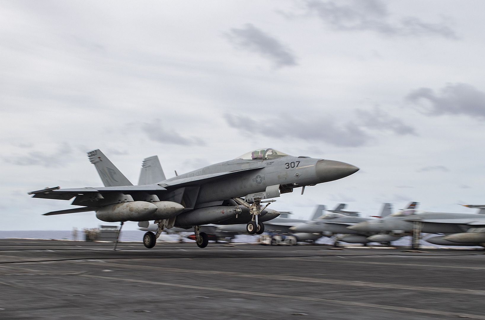 18E Super Hornet From The Kestrels Of Strike Fighter Squadron VFA 137 Makes An Arrested Landing On The Aircraft Carrier USS Nimitz