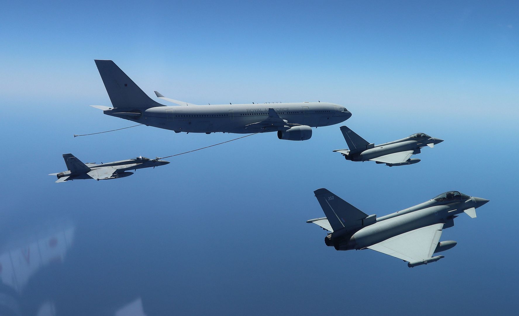 18E Super Hornet Left Attached To The Checkmates Of Strike Fighter Squadron 211 Receives Fuel From A Royal British Air Force Airbus Voyager Tanker