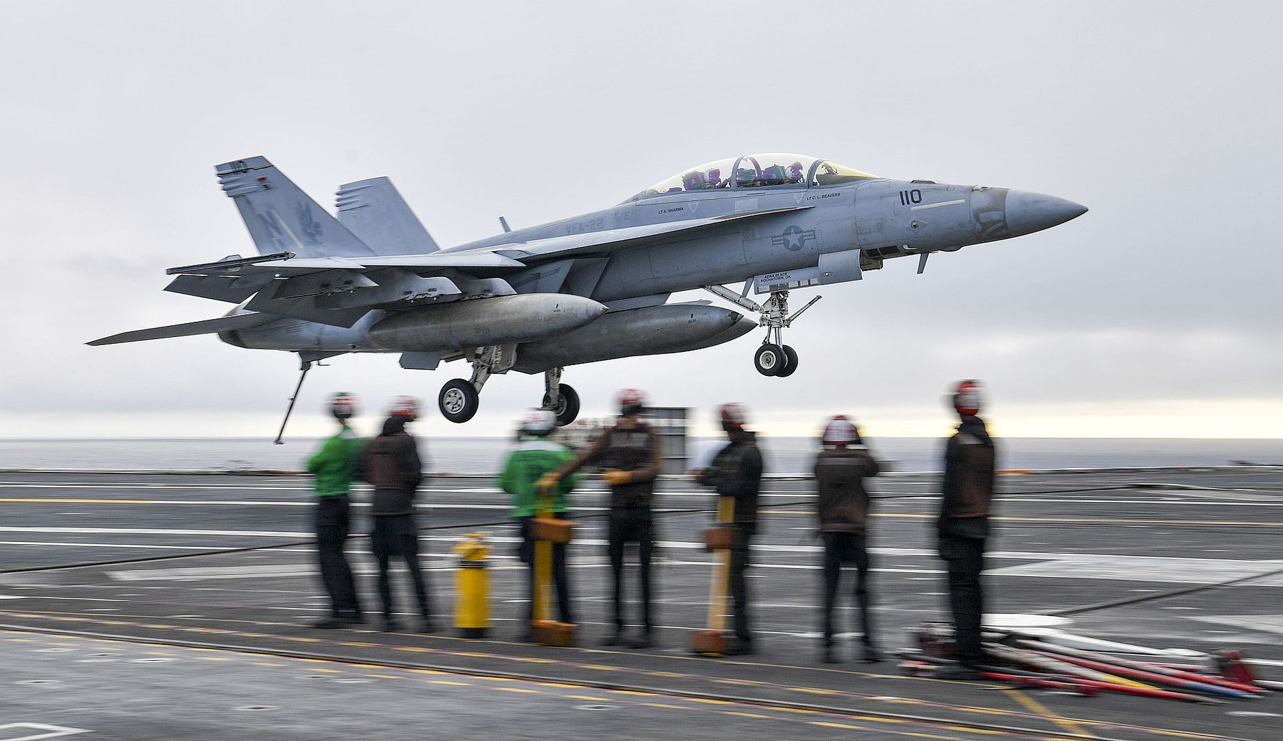 18F Super Hornet From The Fighting Redcocks Of Strike Fighter Squadron 22 Makes An Arrested Gear Landing Aboard The Aircraft Carrier USS Nimitz