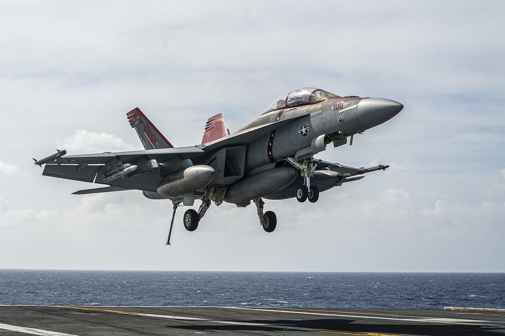 18F Super Hornet From The Fighting Redcocks Of Strike Fighter Squadron 22 Makes An Arrested Landing On The Aircraft Carrier USS Nimitz