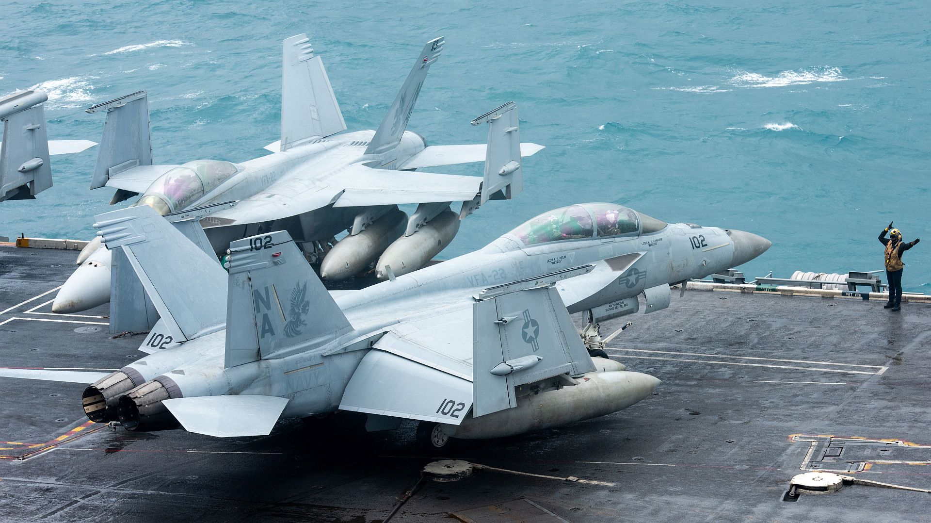 18F Super Hornet From The Fighting Redcocks Of Strike Fighter Squadron 22 On The Flight Deck Aboard The Aircraft Carrier USS Nimitz 18F Super Hornet From The Fighting Redcocks Of Strike Fighter Squadron 22 On The Flight Deck Aboard The Aircraft Carrier USS Nimitz