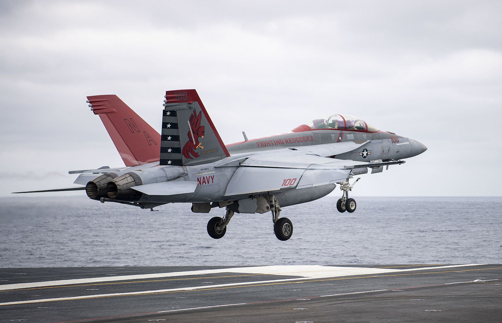 18F Super Hornet From The Fighting Redcocks Of Strike Fighter Squadron 22 Performs A Touch And Go On Flight Deck Of The Aircraft Carrier USS Nimitz