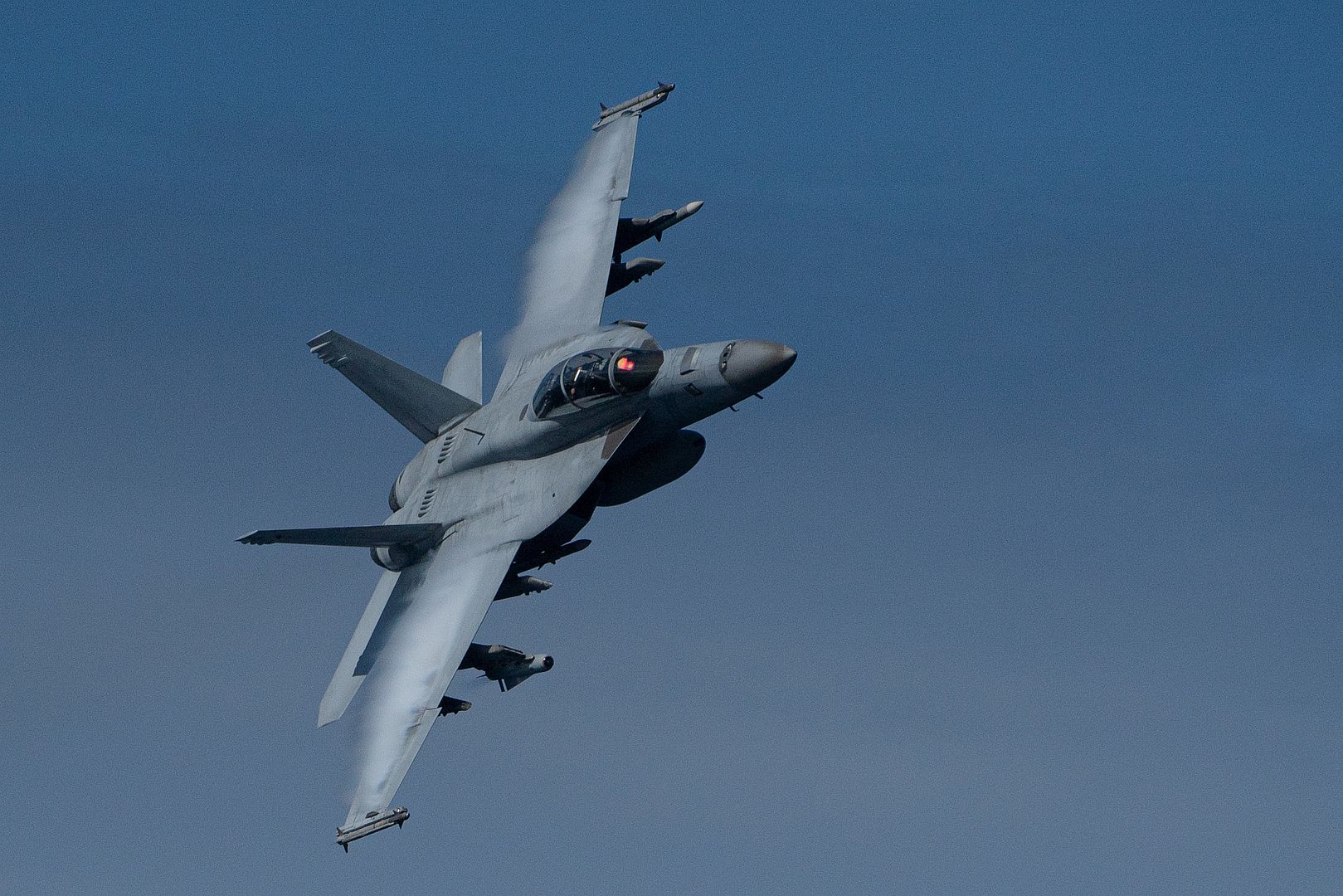 FA 18F Super Hornet Assigned To The Diamondbacks Of Strike Fighter Squadron VFA 102 Flies Past The Arleigh Burke Class Guided Missile Destroyer USS Halsey
