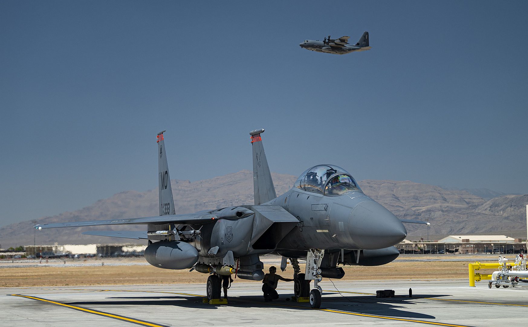 F 15E Strike Eagle Fighter Jet Assigned To The 391st Fighter Squadron At Mountain Home Air Force Base Idaho Prepares To Launch As An HC 130J Combat King II Aircraft Takes Off During Red Flag 20 3