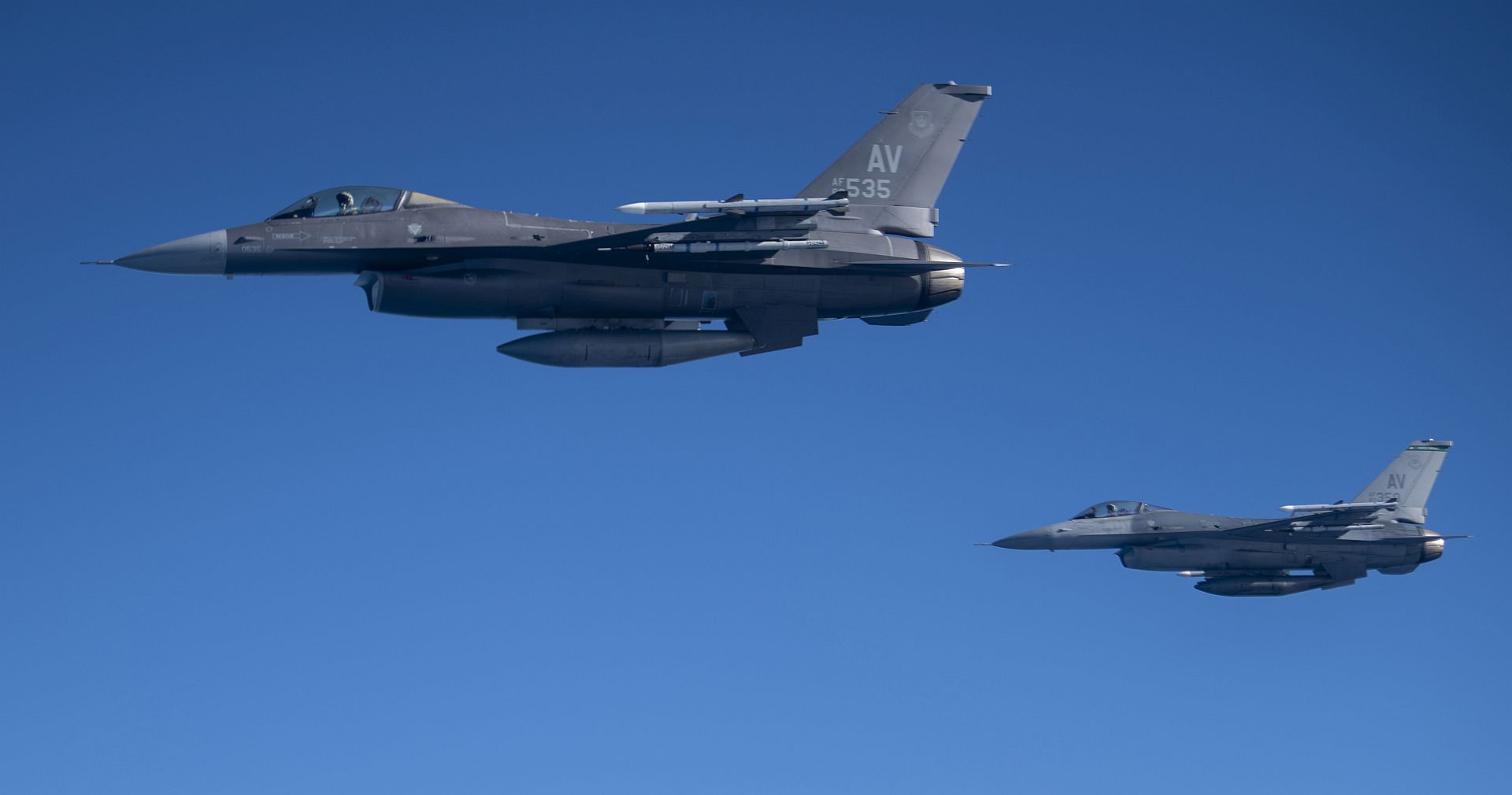 F 16 Fighting Falcon Aircraft Assigned To The 555th Fighter Squadron Aviano Air Base Italy Fly Next To A KC 135 Stratotanker