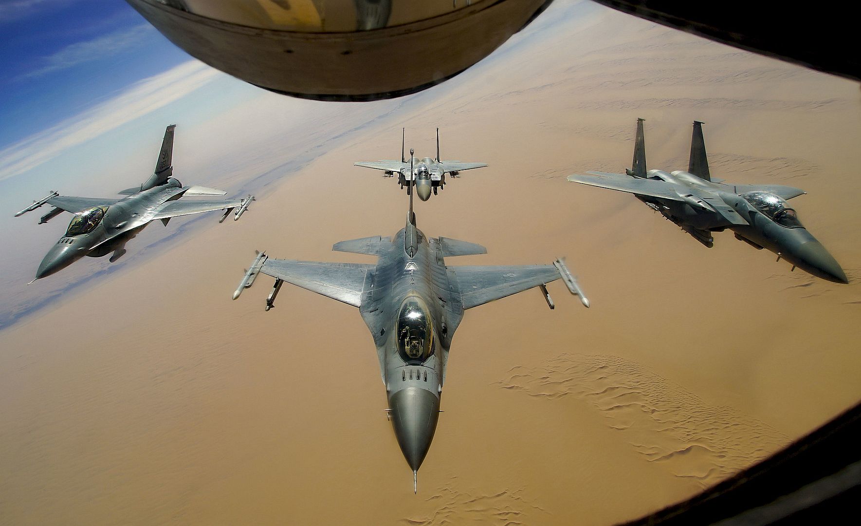 F 16 Fighting Falcons Assigned To The 77th Expeditionary Fighter Squadron Fly In Formation With Two Royal Saudi Air Force F 15E Strike Eagles F 16 Fighting Falcons Assigned To The 77th Expeditionary Fighter Squadron Fly In Formation With Two Royal Saudi Air Force F 15E Strike Eagles