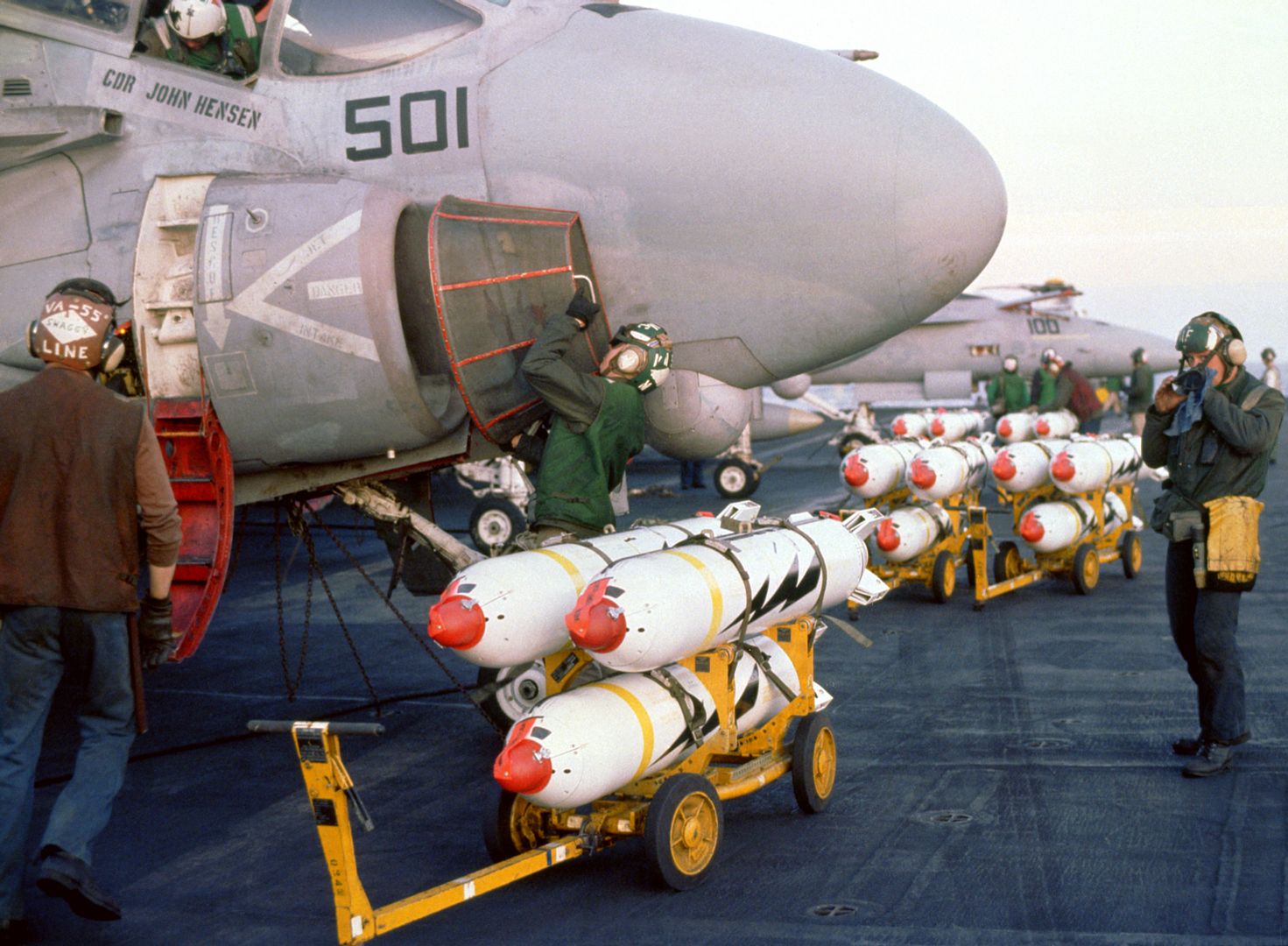  Bomb Skids Loaded With CBU 59 Cluster Bombs Are Staged In Front Of The Aircraft