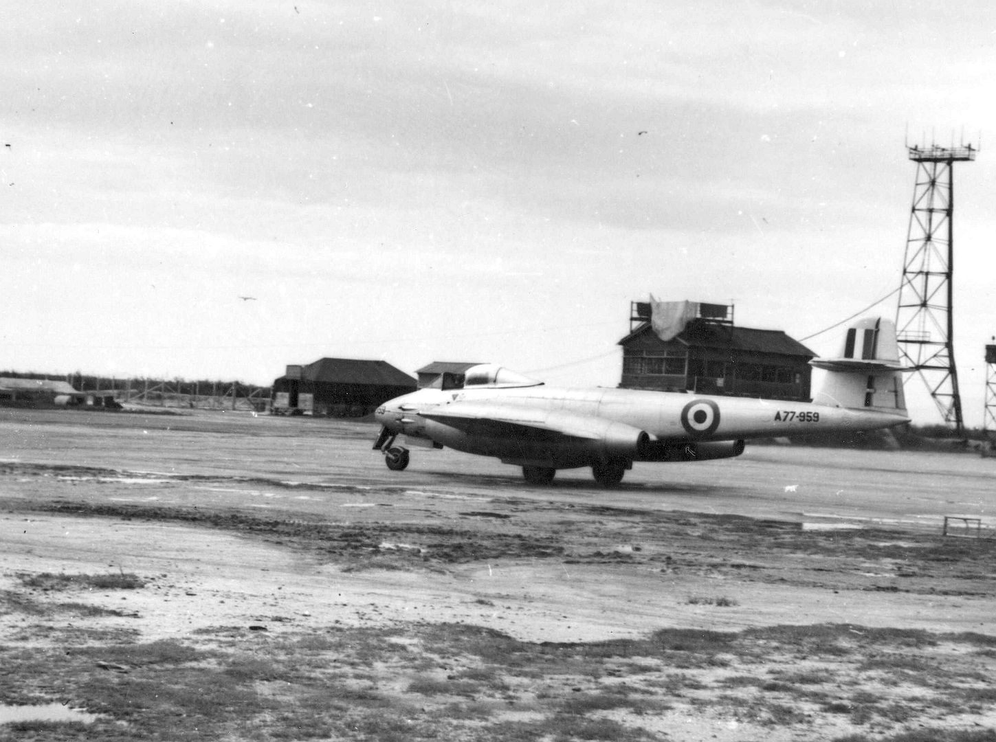 Gloster Meteor Aeroplane Taxies Away From The Hangars To The Runway Prior To Taking Off On A Training Flight In Southern Japan Gloster Meteor Aeroplane Taxies Away From The Hangars To The Runway Prior To Taking Off On A Training Flight In Southern Japan