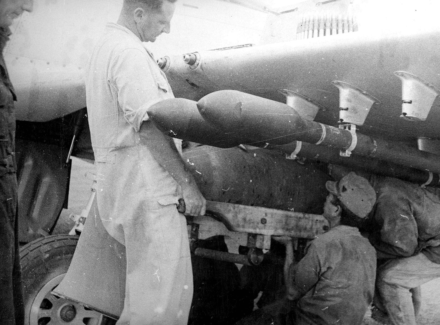 Japanese Helps Load Bombs And Rockets On Mustang Before Korea Raid