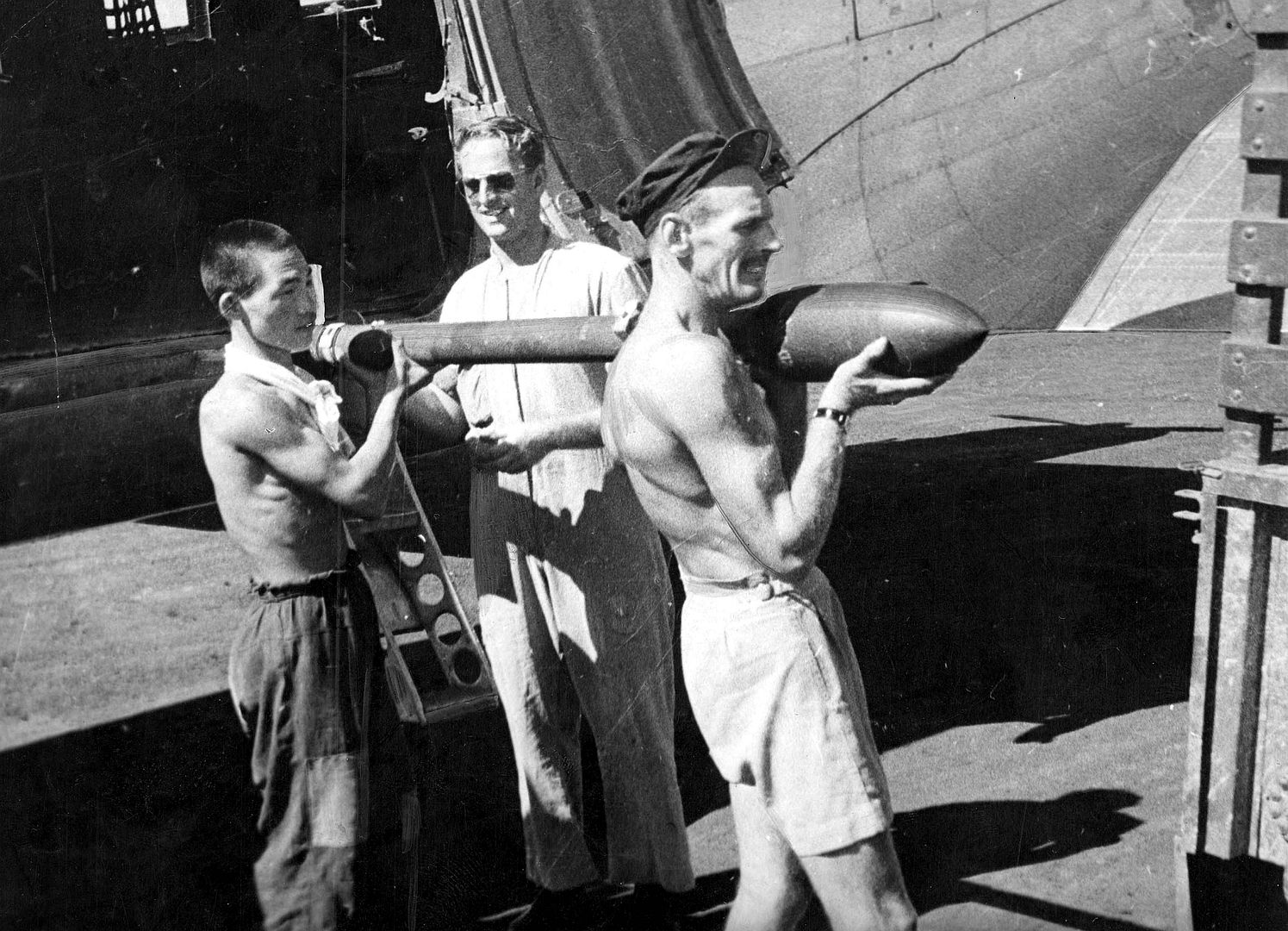 Japanese Helps Load Rockets On RAAF Mustang At Iwakuni Japan 