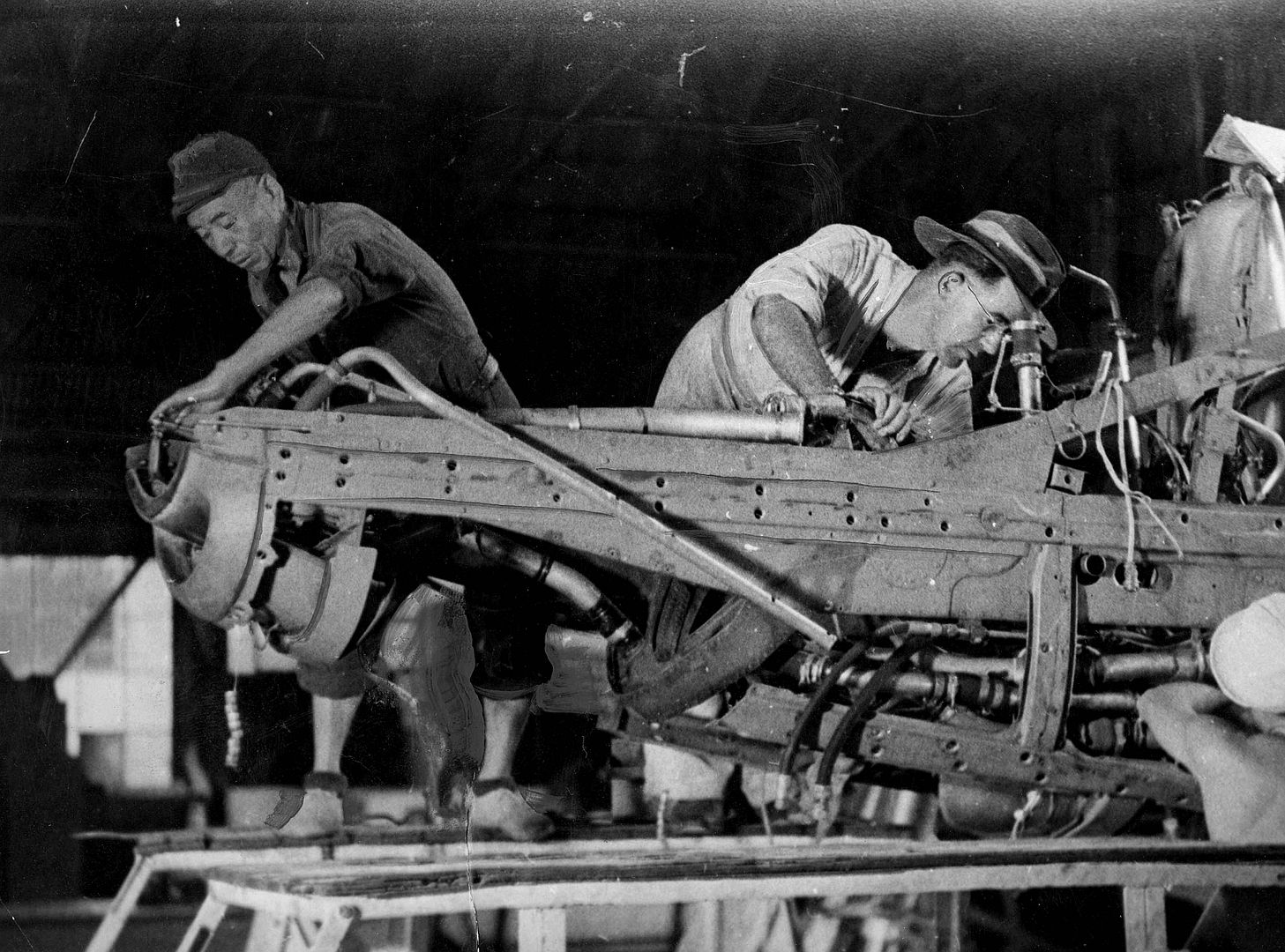 Japanese Works With RAAF Man On Mustang Engine Repairs