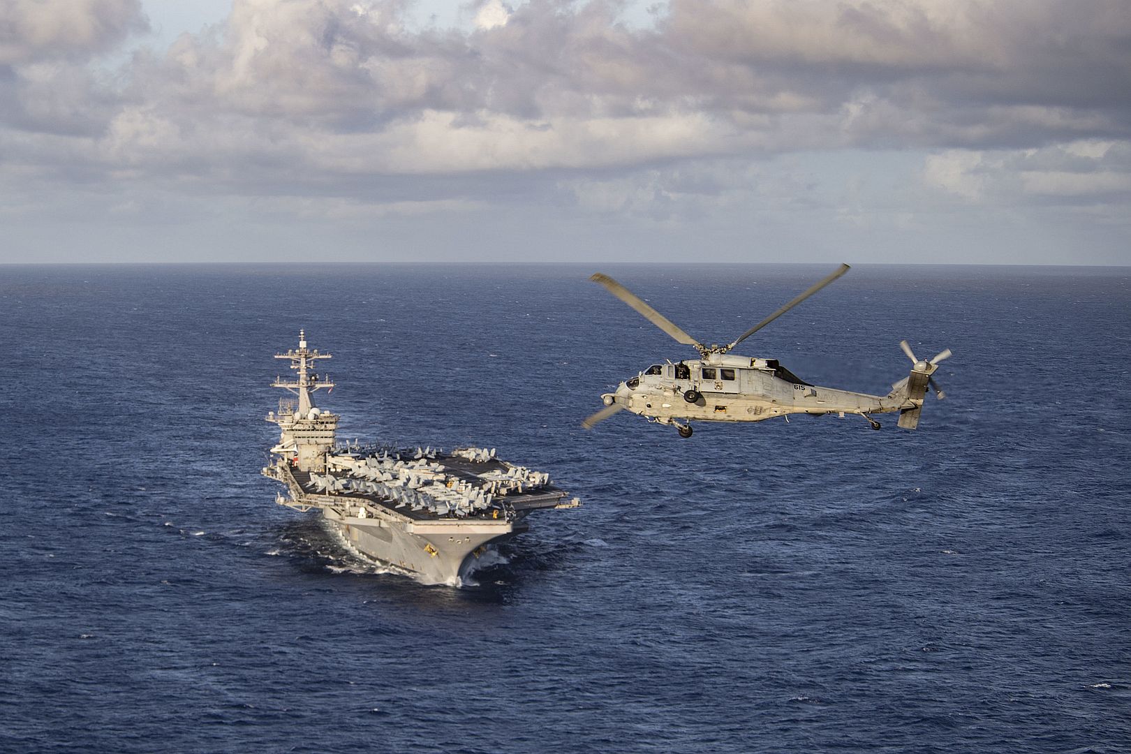 Flies In Front Of The Aircraft Carrier USS Theodore Roosevelt Flies In Front Of The Aircraft Carrier USS Theodore Roosevelt