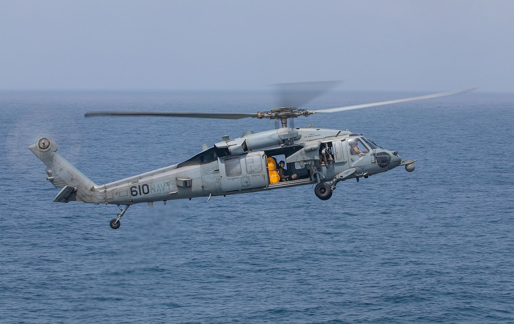 60S Sea Hawk Helicopter Attached To The Golden Falcons Of Helicopter Sea Combat Squadron 12 Prepares To Land On The Flight Deck Of Aircraft Carrier USS Ronald Reagan