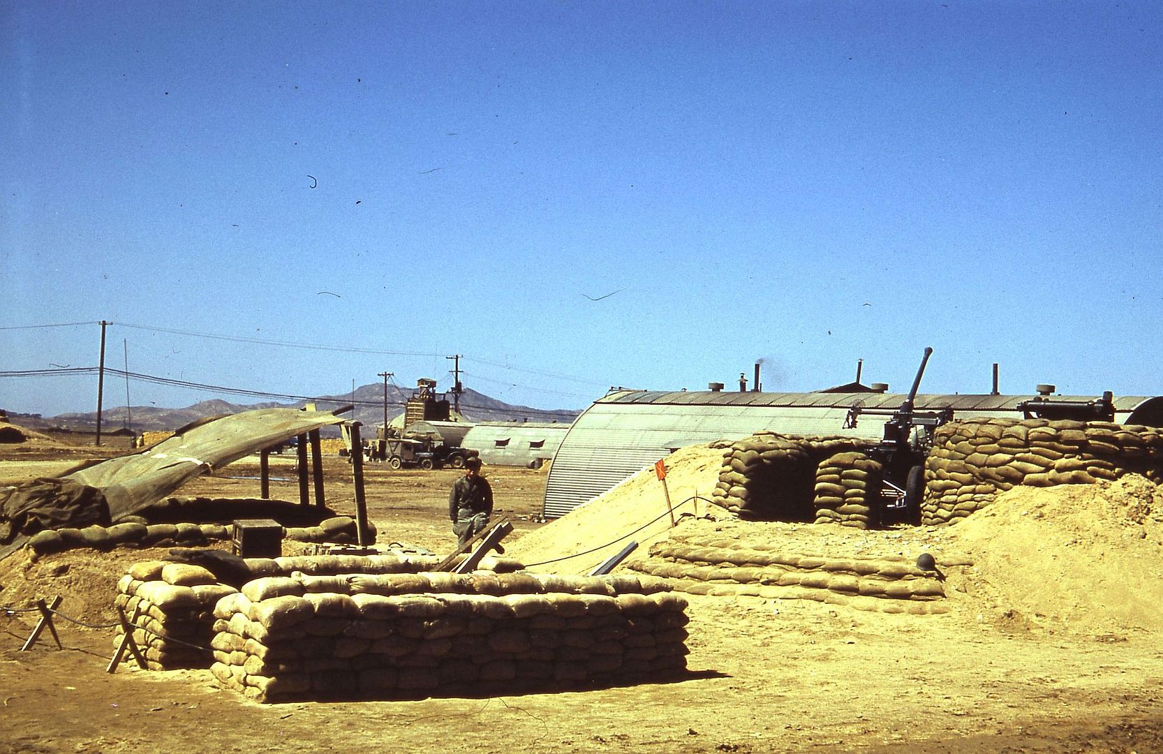 Aircraft Gun In A Sandbagged Emplacement At An Airbase Somewhere In Korea