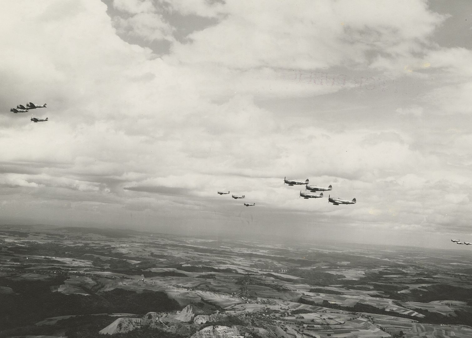 47 Thunderbolt Aircraft In Flight Over An Unidentified Location Circa 1945