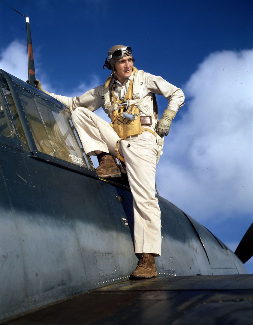Pilot Climbs Into Cockpit Of F6F Pilot Climbs Into Cockpit Of F6F