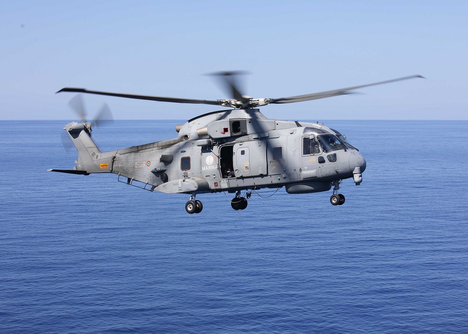 SH101 A Helicopter Prepares To Land On The Flight Deck Of The Wasp Class Amphibious Assault Ship USS Bataan
