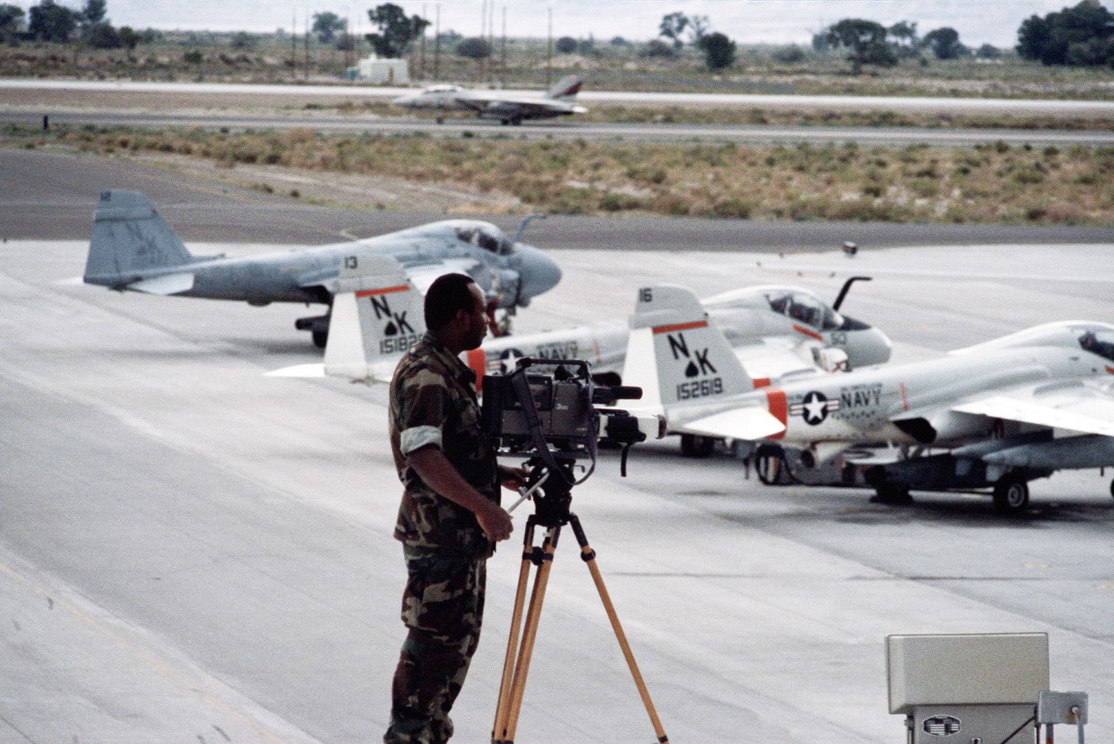 Standing Behind Them A Video Cameraman Films Three A 6 Intruder Aircraft On The Flight Line During Exercise GALLANT EAGLE 88
