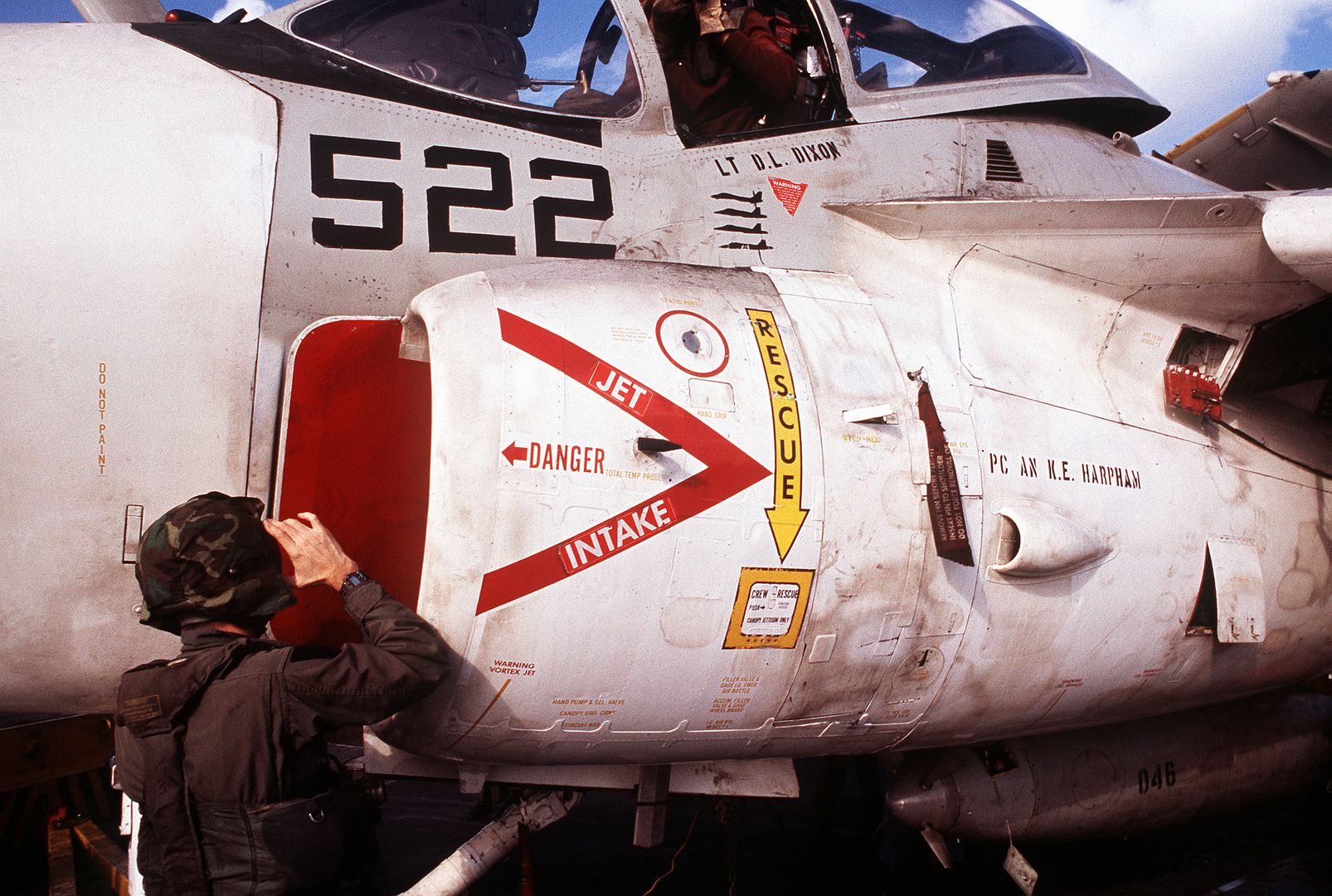 The Pilot Of An Attack Squadron 35 A 6E Intruder Aircraft Performs A Preflight Check On His Plane Prior To Taking Off From The Flight Deck Of The Aircraft Carrier USS SARATOGA During Operation Desert Storm
