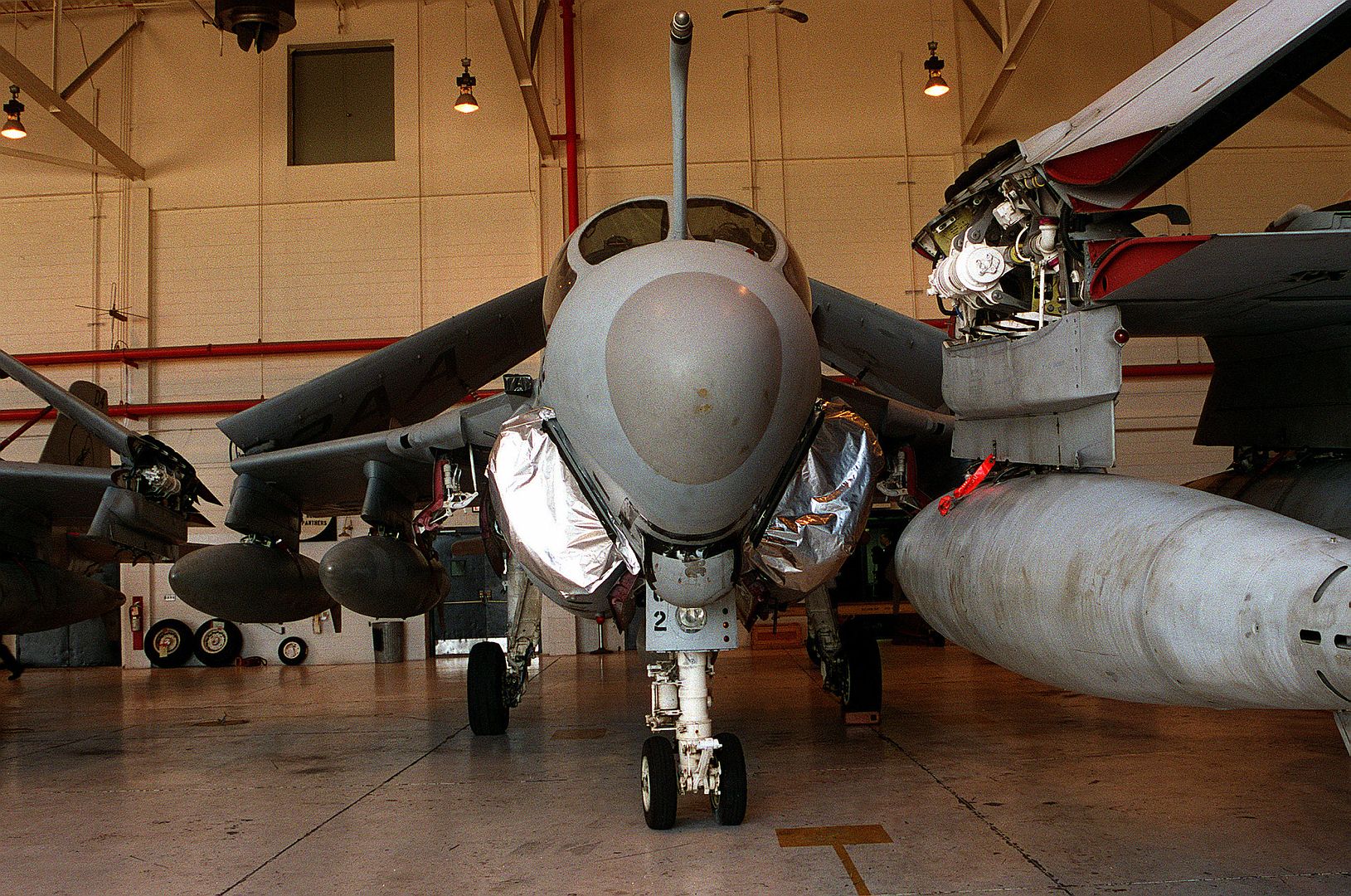 Two A 6E Intruder Aircraft Of Attack Squadron 35 Are Shown Secured Inside Hangar III