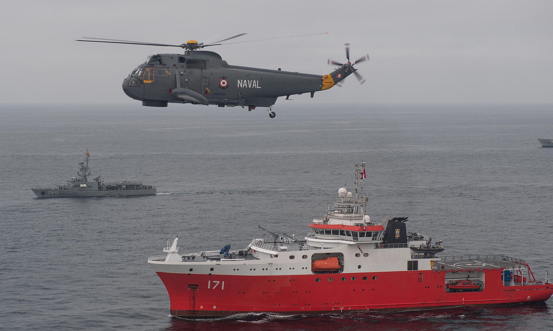 3H Sea King Helicopter Flies Overhead BAP Carrasco