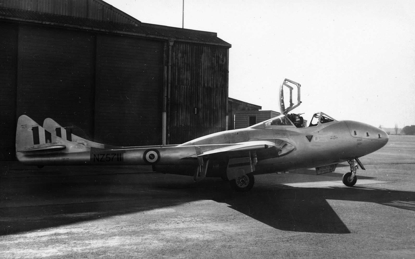 Vampire T11 NZ 5711 In Front Of A Hangar