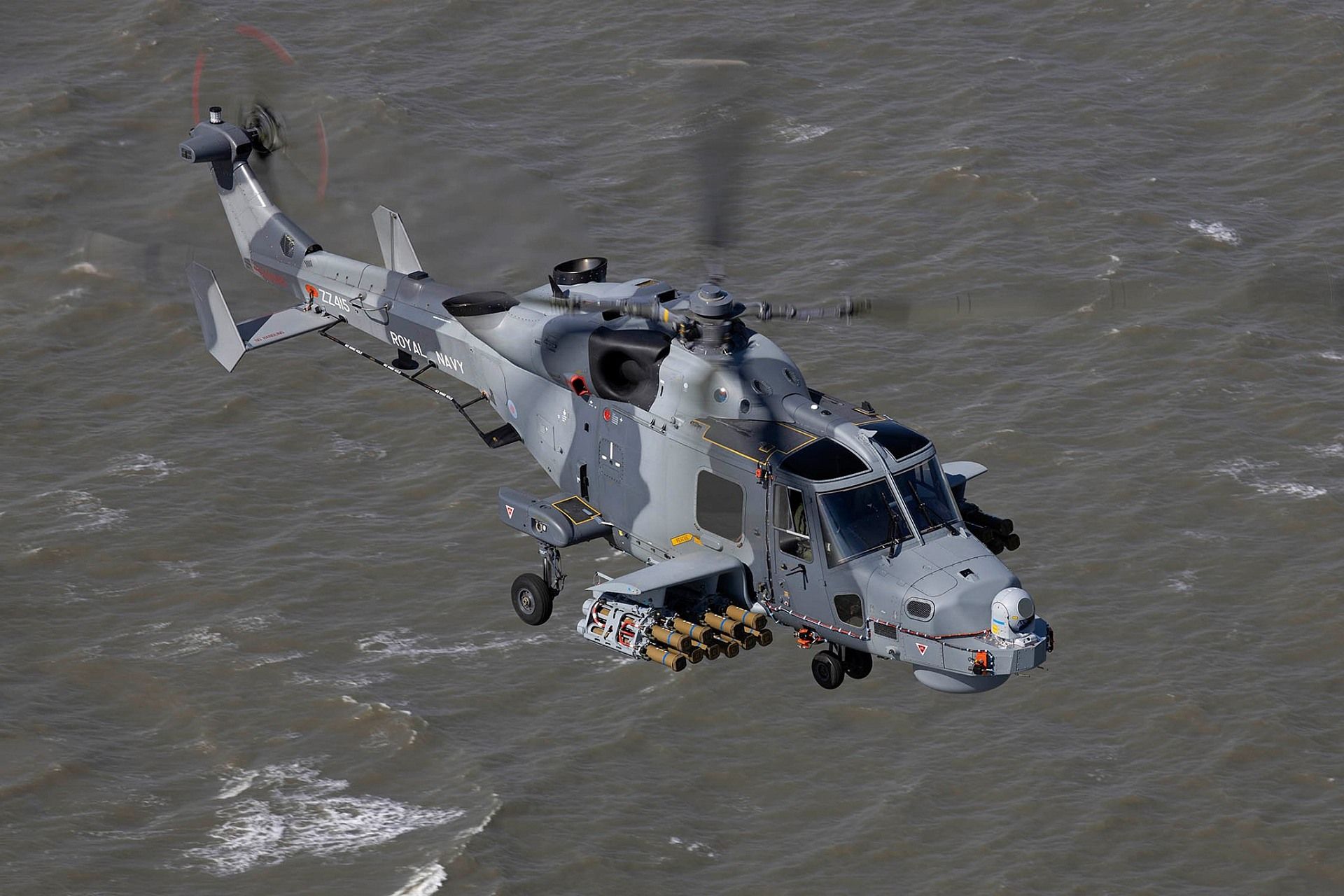Wildcat Helicopter From RNAS Yeovilton Flies Around A Range Off The Coast Of Wales