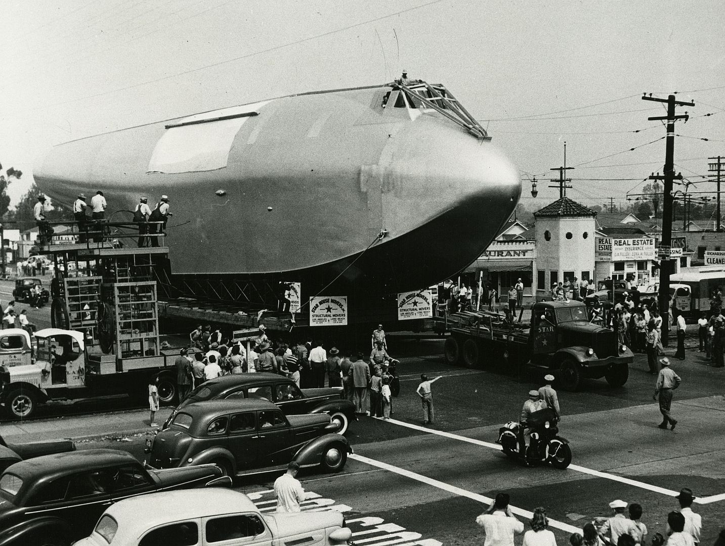Fuselage Of The Hughes Flying Boat Being Moved To The Los Angeles Harbor 1946 3E7ShvDwvepPGihz34viT9