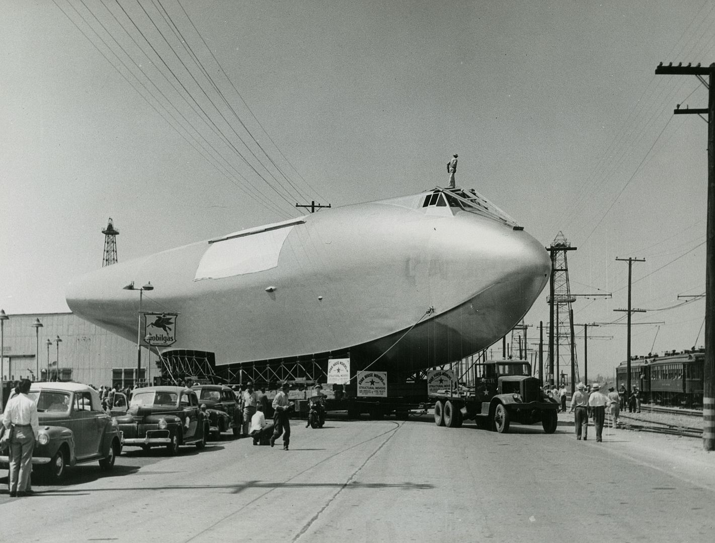 Fuselage Portion Of Hughes Flying Boat Being Moved To Terminal Island In The Los Angeles Harbor 1946 FTDVadwRMABpGX7w9Loj5N