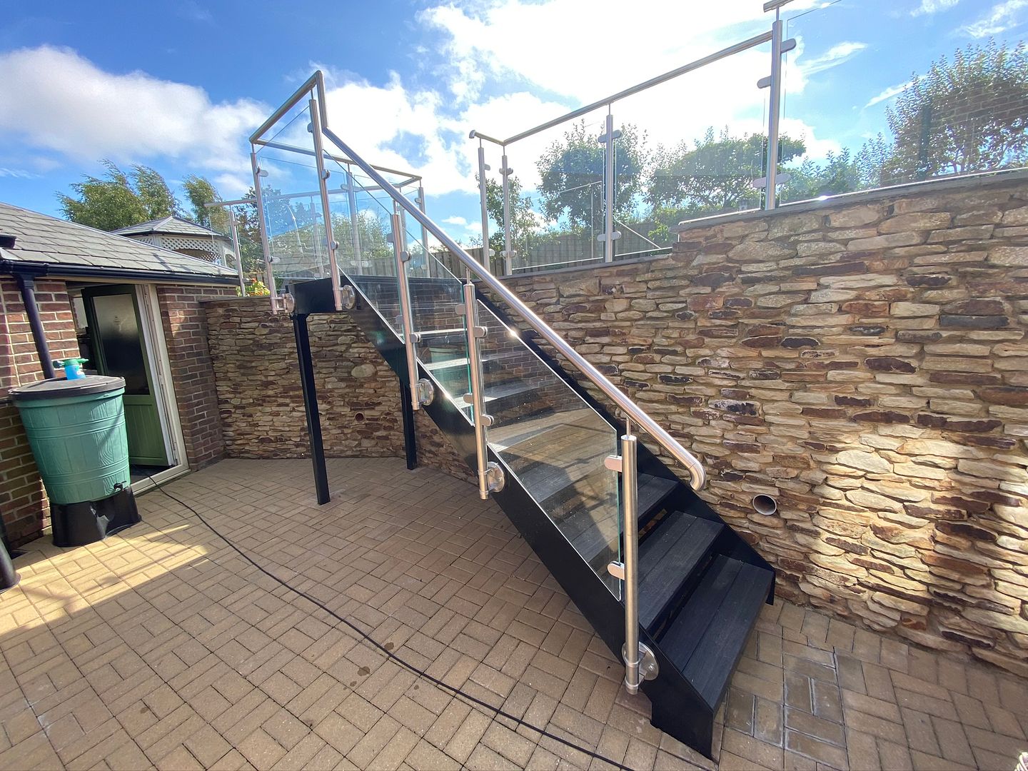 Modern garden staircase with glass