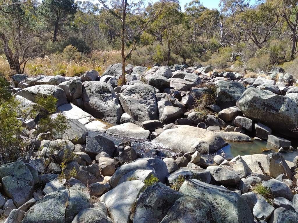 River filled with large basalt boulders and rocks